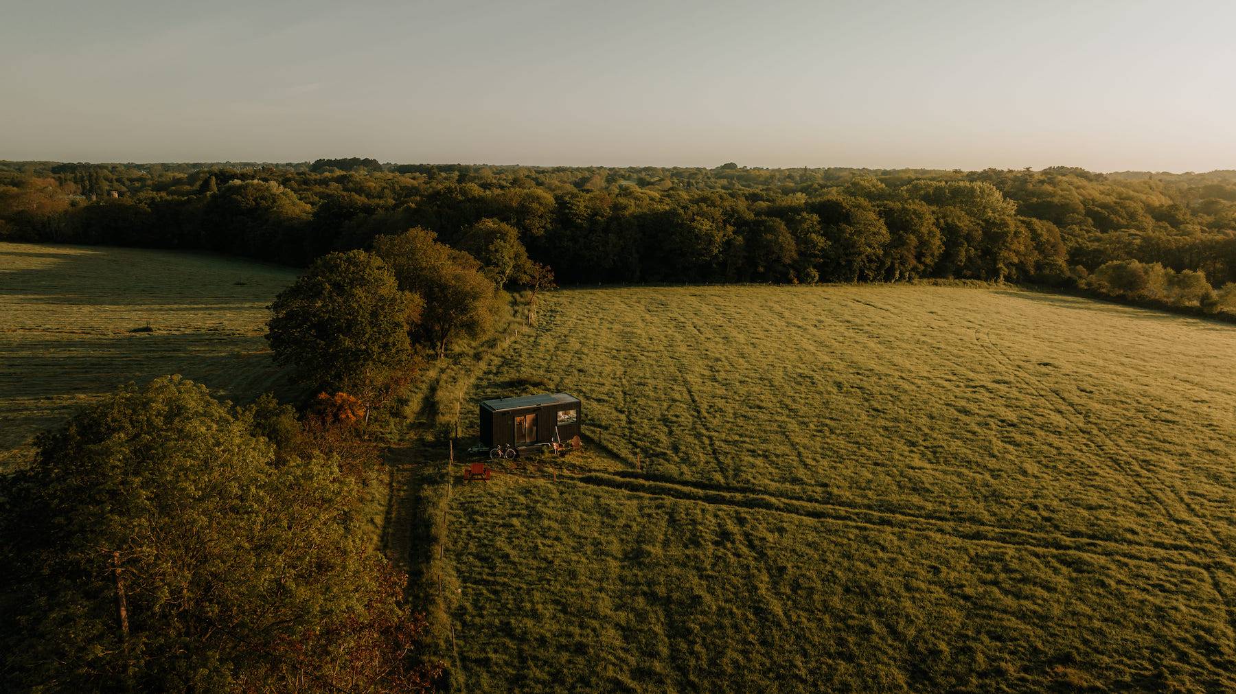 Drone view of the Tiny House set in a meadow